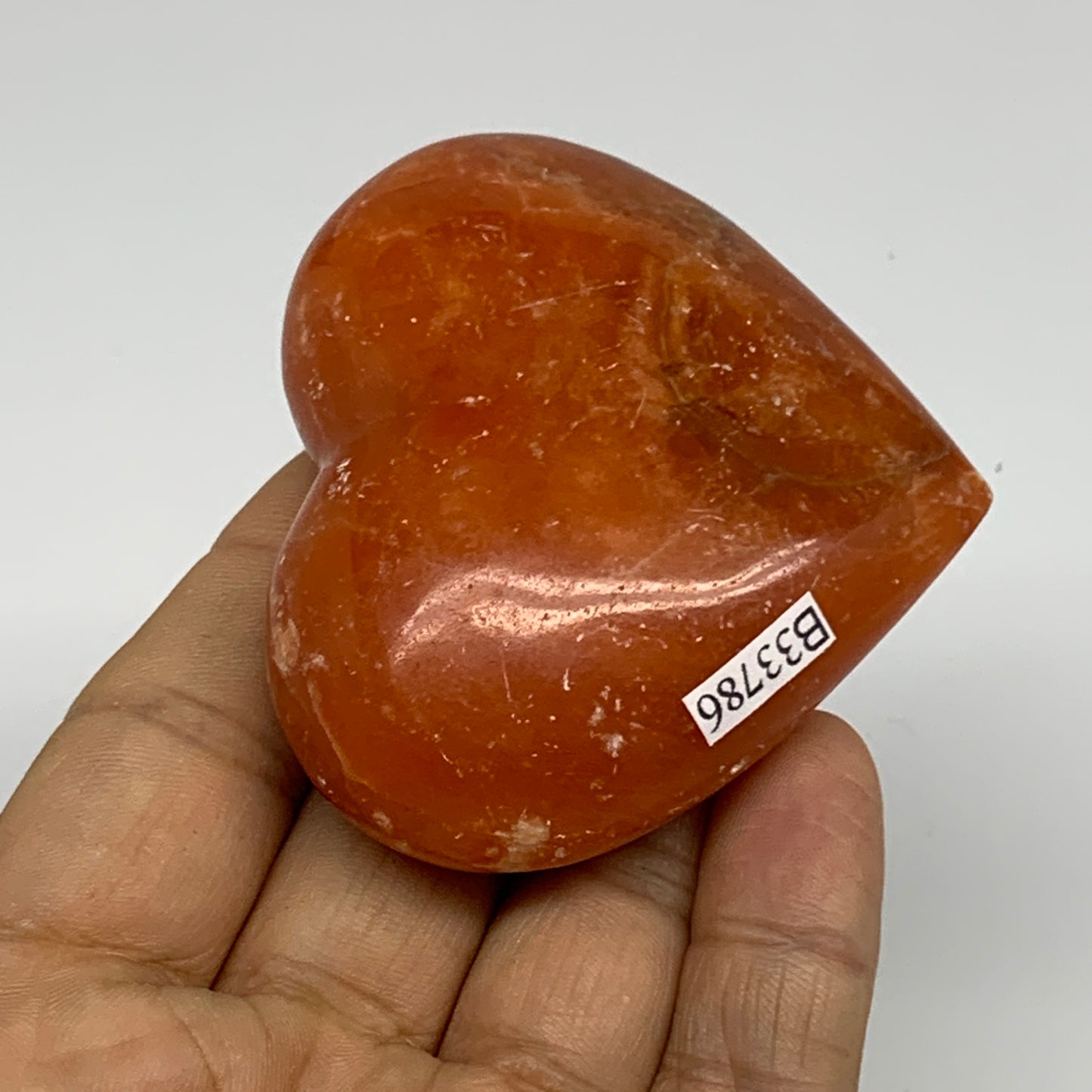 109.9g, 2.2"x2.6"x1" Orange Calcite Heart Gemstones from Madagascar, B33786