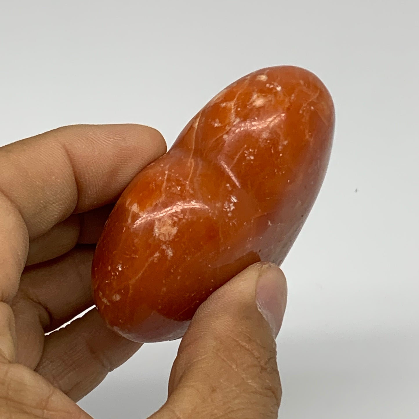 109.9g, 2.2"x2.6"x1" Orange Calcite Heart Gemstones from Madagascar, B33786