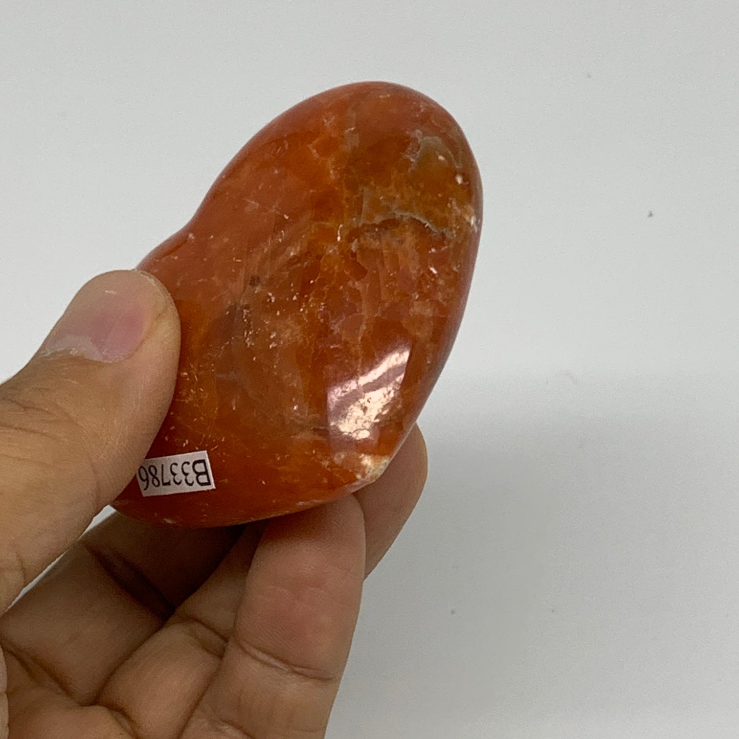 109.9g, 2.2"x2.6"x1" Orange Calcite Heart Gemstones from Madagascar, B33786