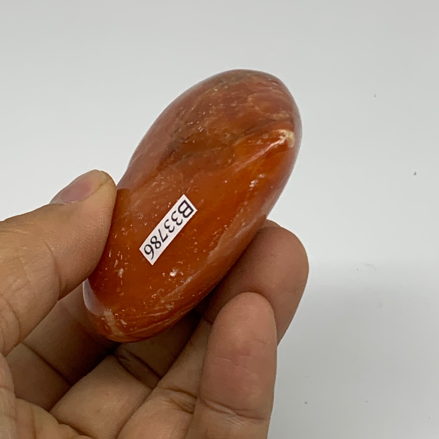 109.9g, 2.2"x2.6"x1" Orange Calcite Heart Gemstones from Madagascar, B33786