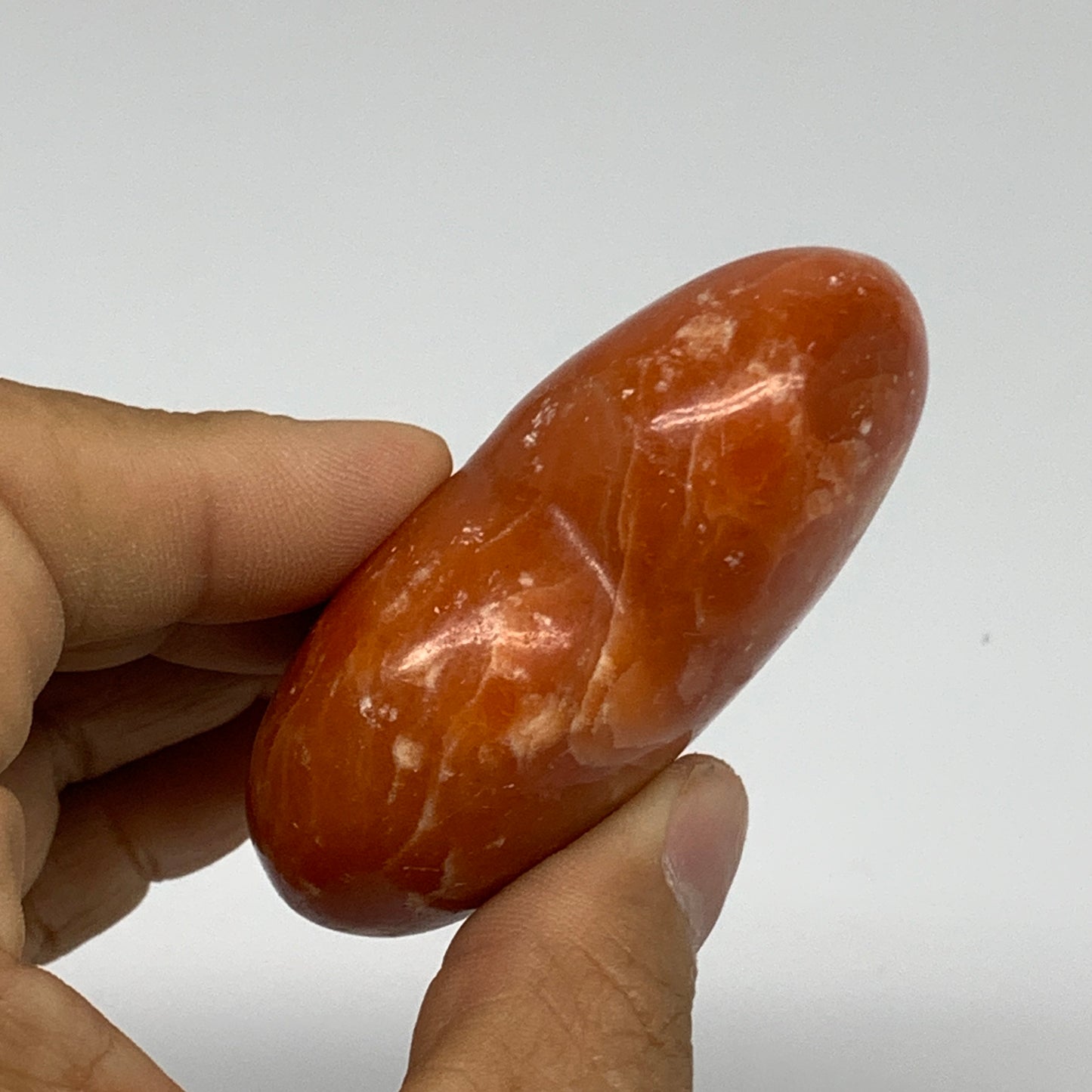 109.9g, 2.2"x2.6"x1" Orange Calcite Heart Gemstones from Madagascar, B33786