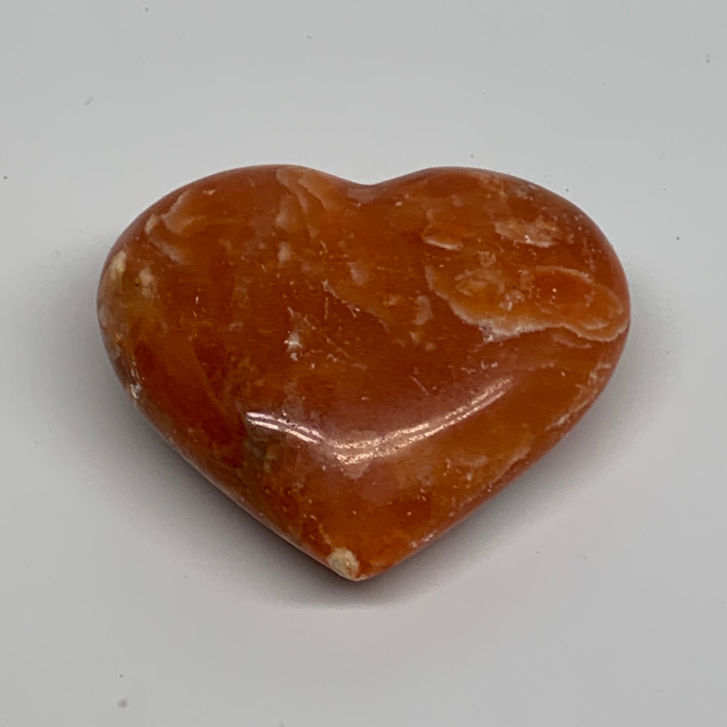 109.9g, 2.2"x2.6"x1" Orange Calcite Heart Gemstones from Madagascar, B33786