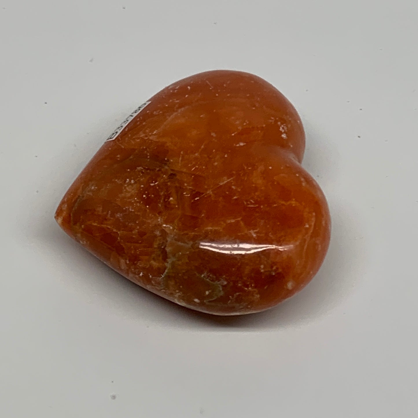 109.9g, 2.2"x2.6"x1" Orange Calcite Heart Gemstones from Madagascar, B33786