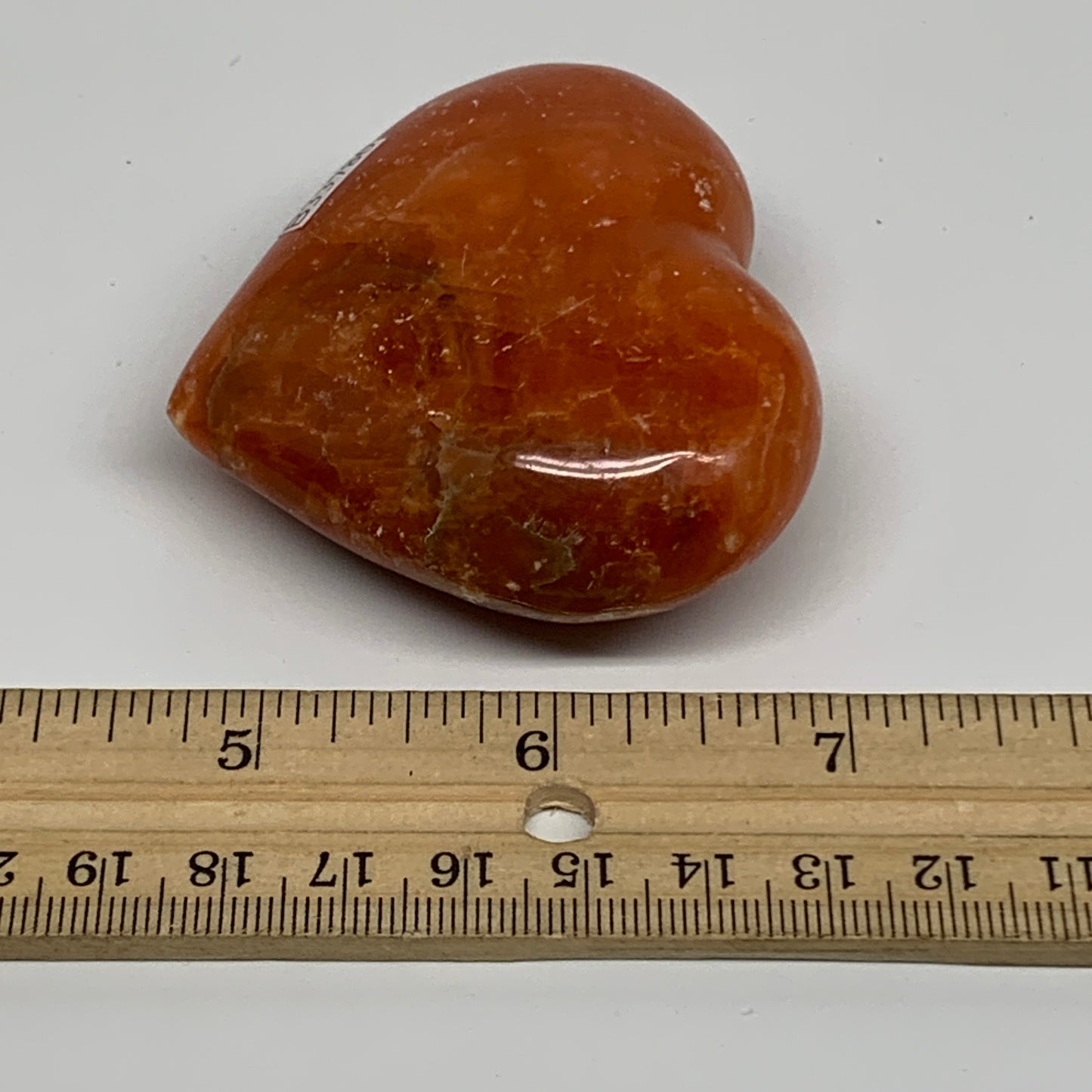 109.9g, 2.2"x2.6"x1" Orange Calcite Heart Gemstones from Madagascar, B33786