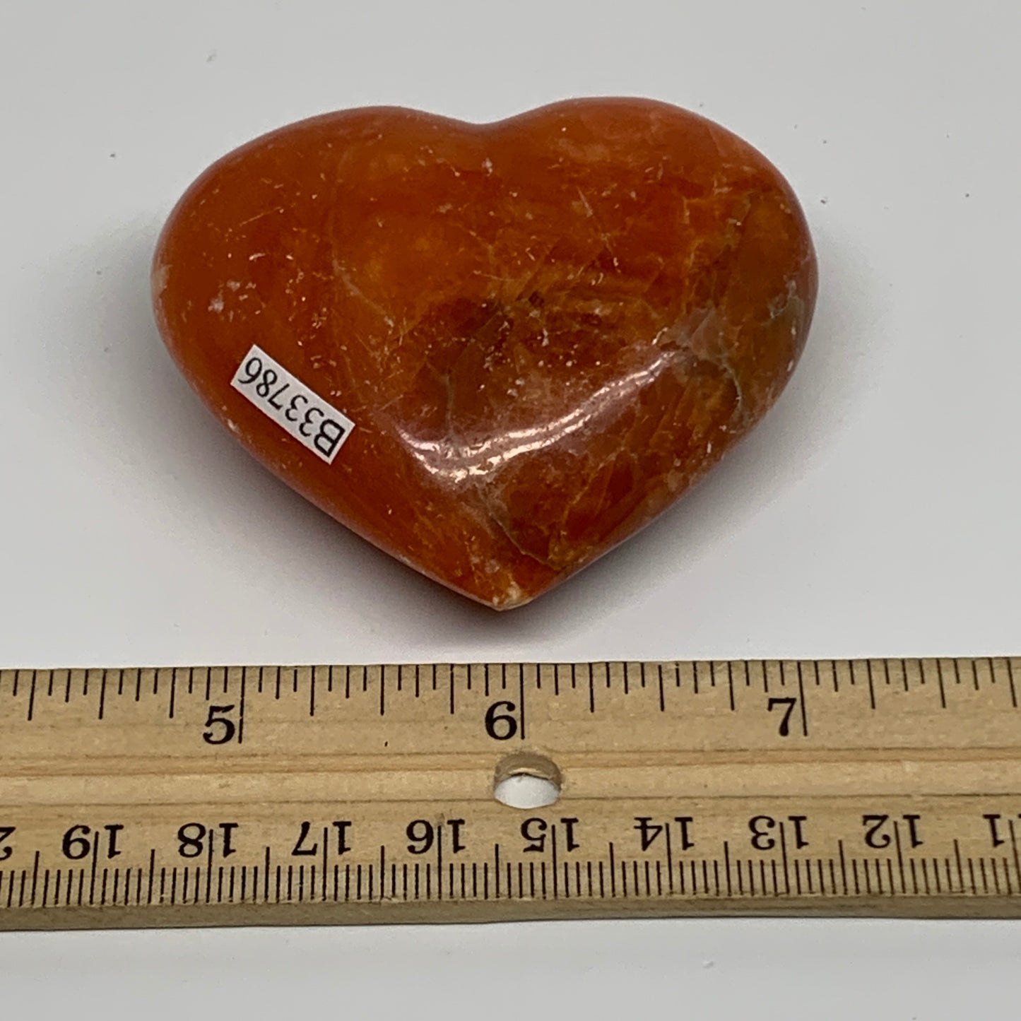 109.9g, 2.2"x2.6"x1" Orange Calcite Heart Gemstones from Madagascar, B33786