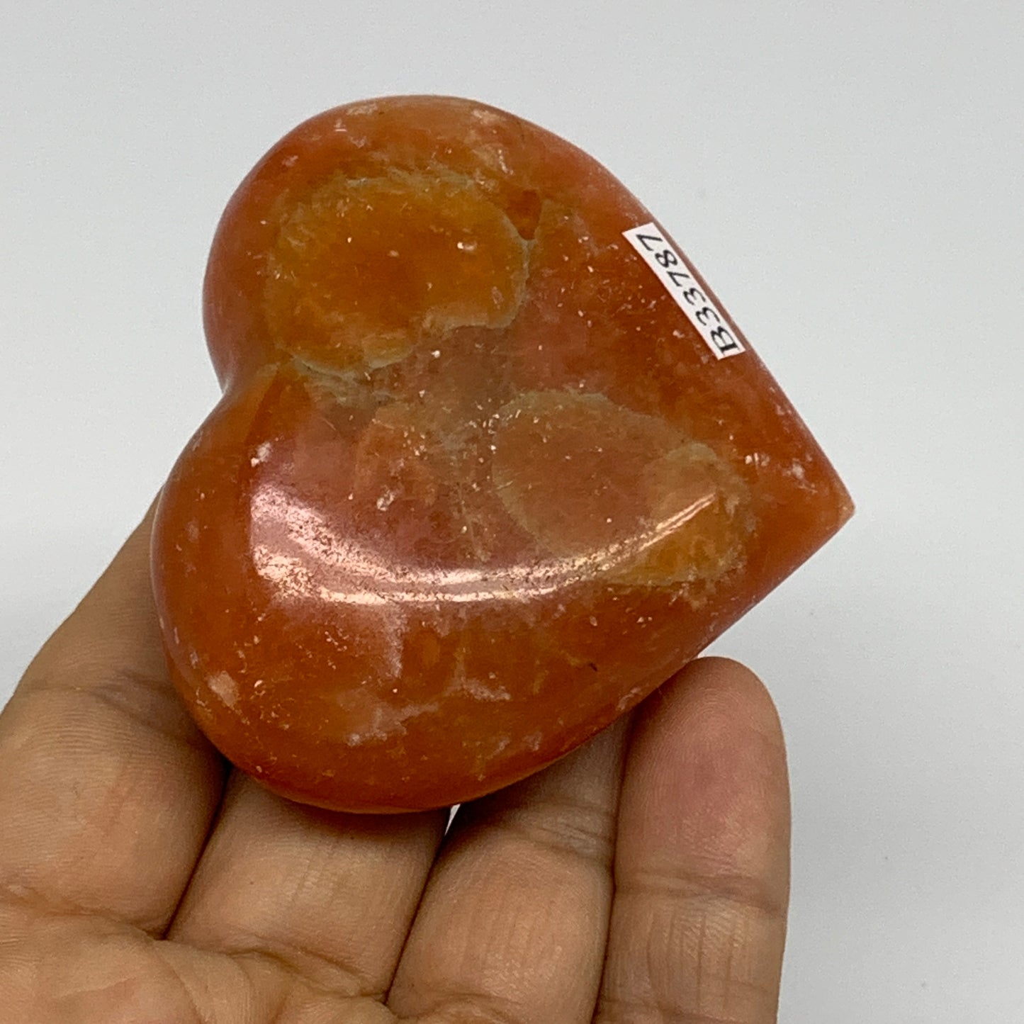 113.7g, 2.3"x2.6"x1" Orange Calcite Heart Gemstones from Madagascar, B33787