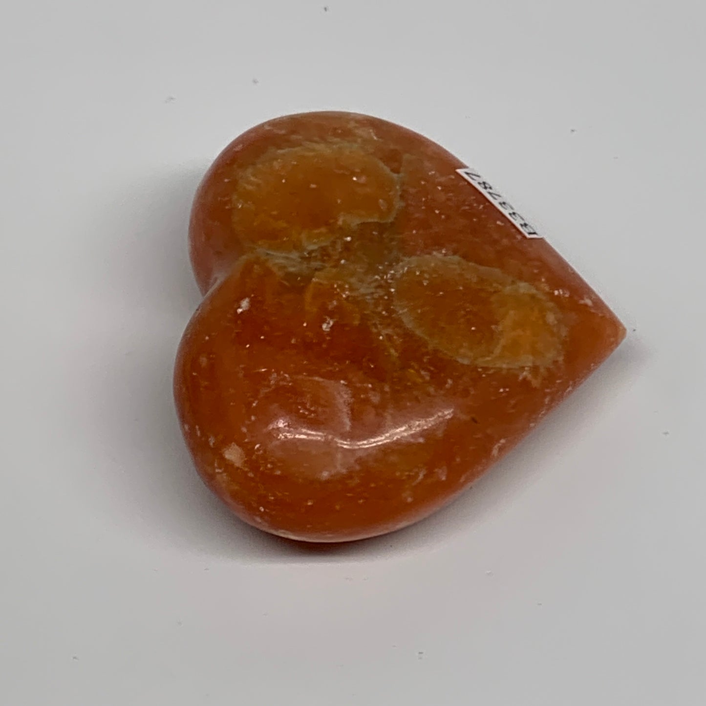 113.7g, 2.3"x2.6"x1" Orange Calcite Heart Gemstones from Madagascar, B33787