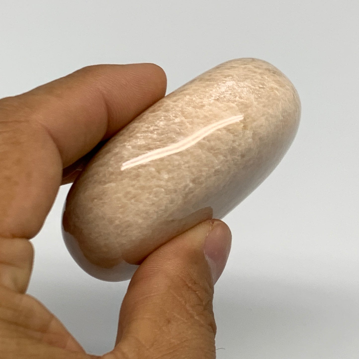 122.8g,2.4"x1.8"x0.9" Peach Moonstone Crystal Palm-Stone Polished Reiki, B27976