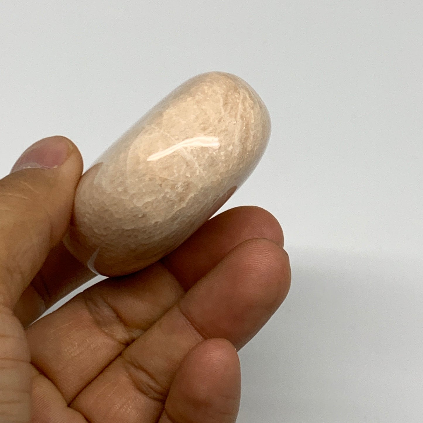 122.8g,2.4"x1.8"x0.9" Peach Moonstone Crystal Palm-Stone Polished Reiki, B27976