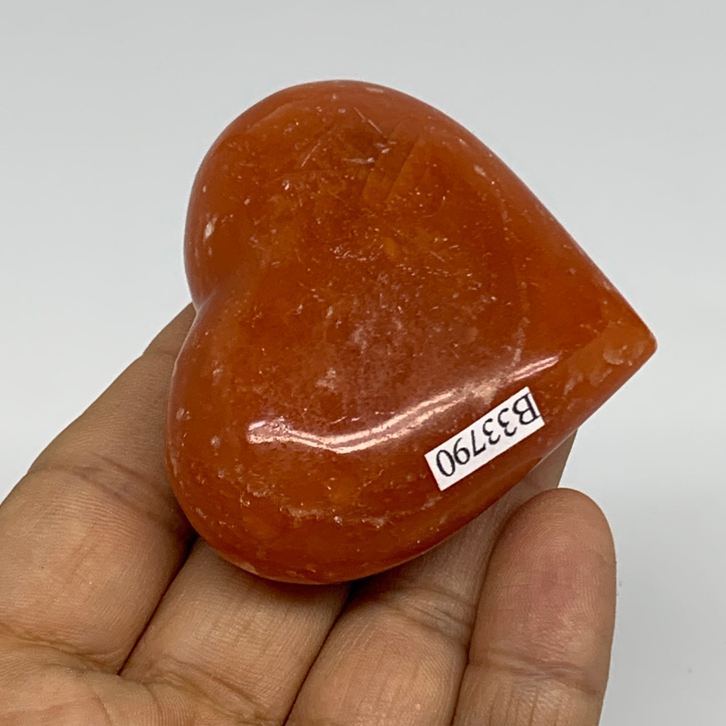 89.4g, 2"x2.4"x1" Orange Calcite Heart Gemstones from Madagascar, B33790