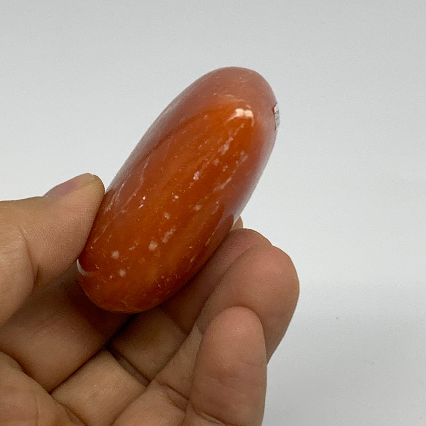 89.4g, 2"x2.4"x1" Orange Calcite Heart Gemstones from Madagascar, B33790