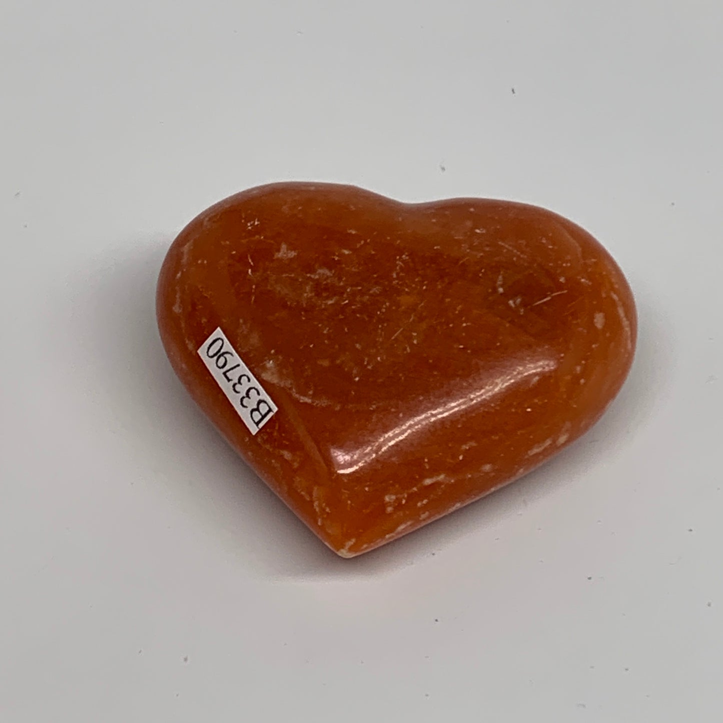 89.4g, 2"x2.4"x1" Orange Calcite Heart Gemstones from Madagascar, B33790