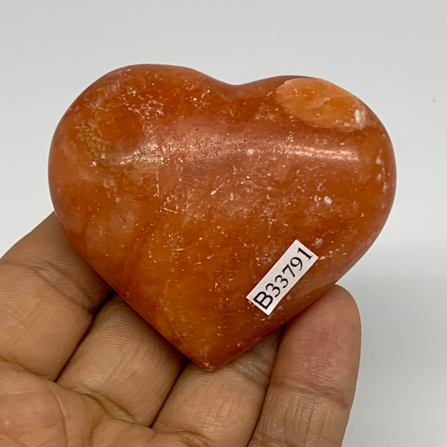 97.4g, 2.1"x2.4"x1" Orange Calcite Heart Gemstones from Madagascar, B33791