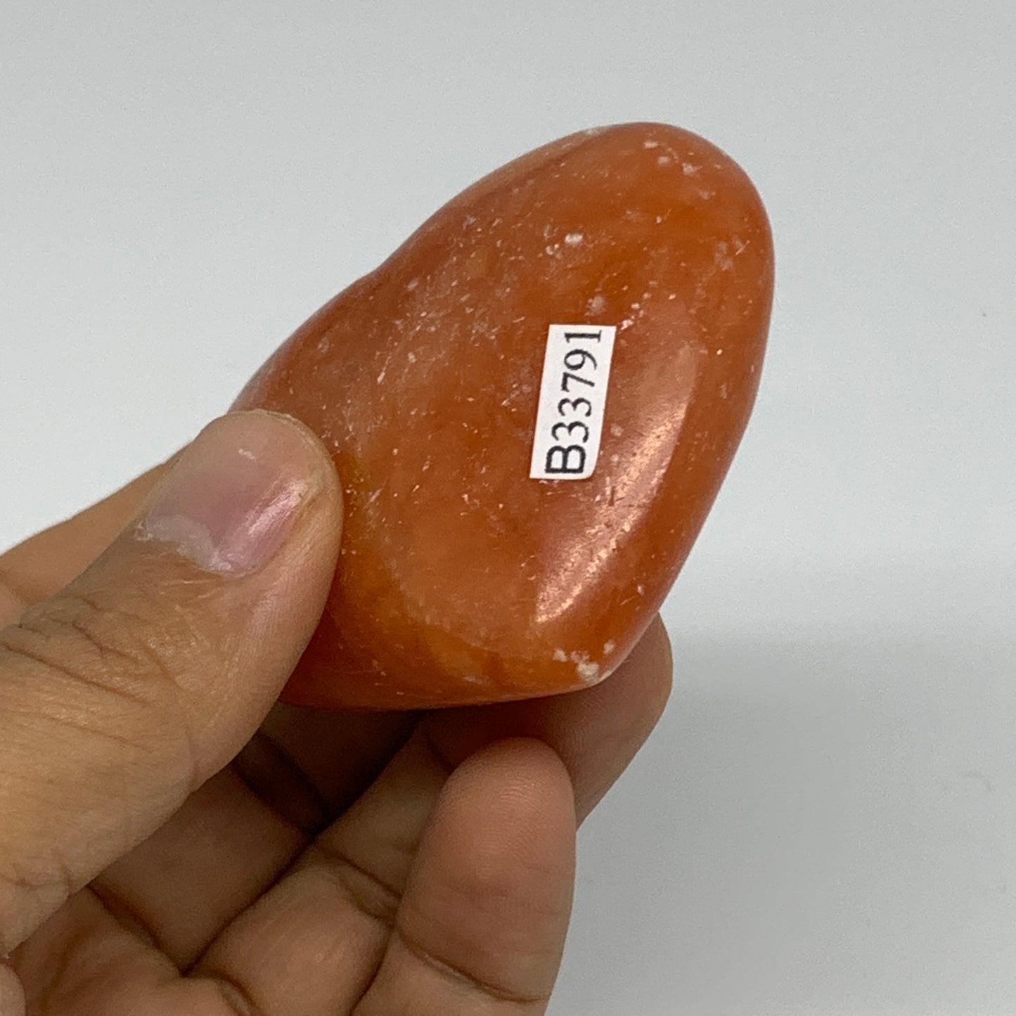 97.4g, 2.1"x2.4"x1" Orange Calcite Heart Gemstones from Madagascar, B33791