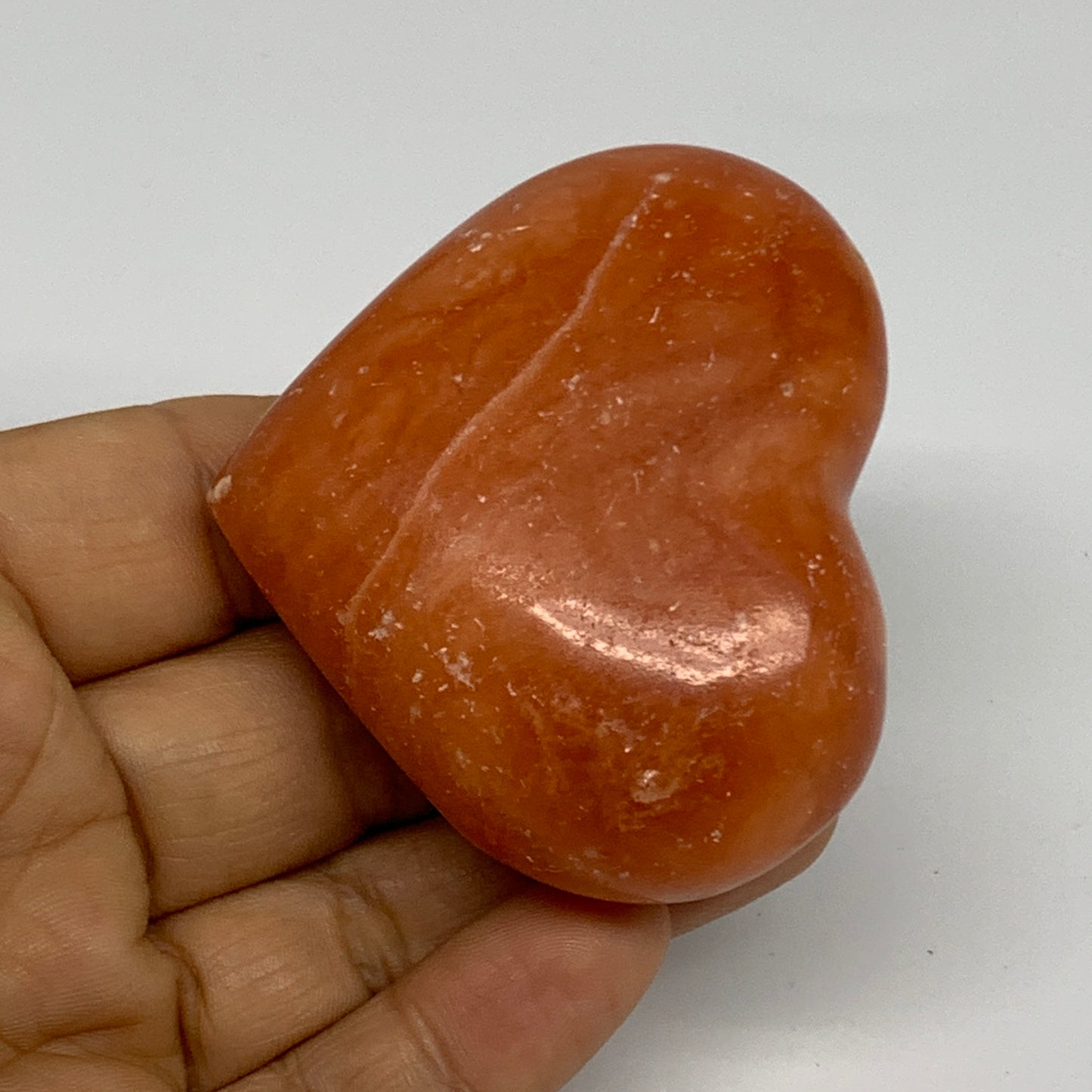 97.4g, 2.1"x2.4"x1" Orange Calcite Heart Gemstones from Madagascar, B33791
