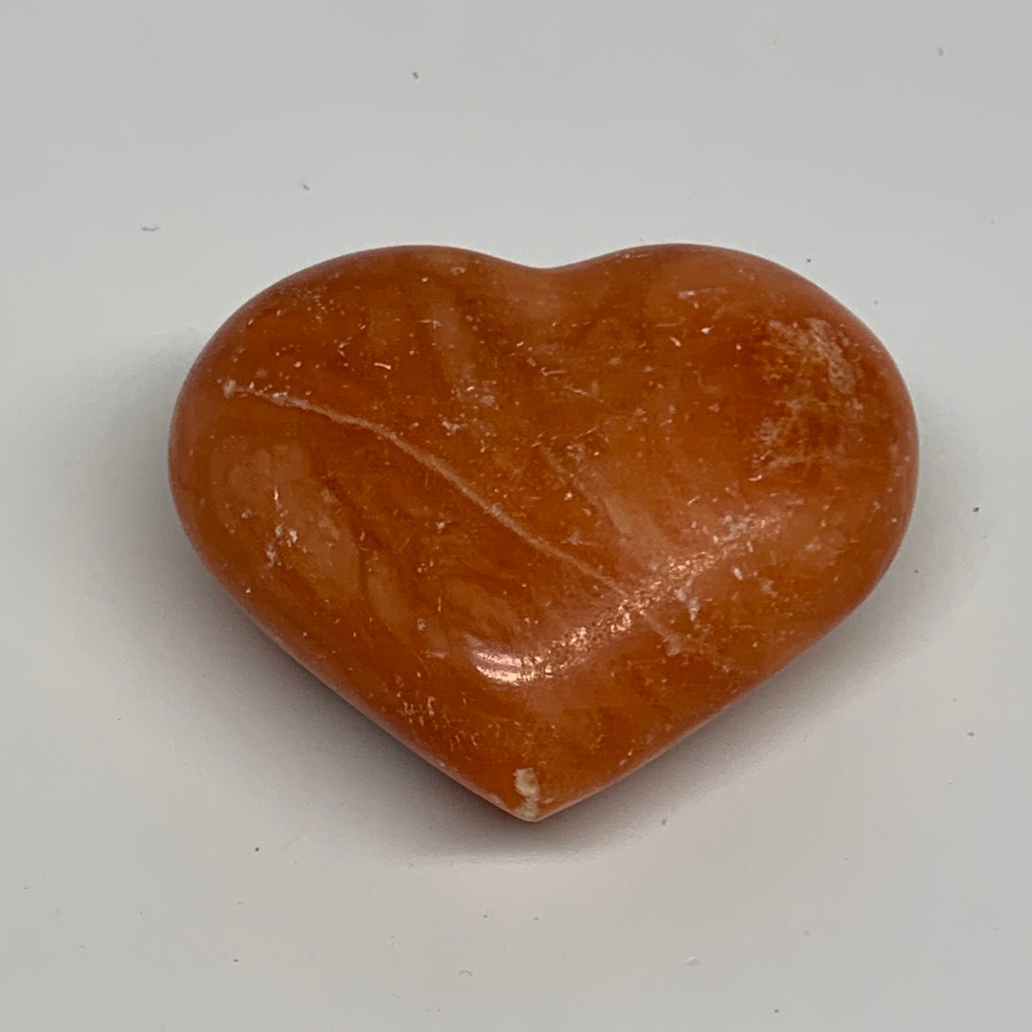 97.4g, 2.1"x2.4"x1" Orange Calcite Heart Gemstones from Madagascar, B33791