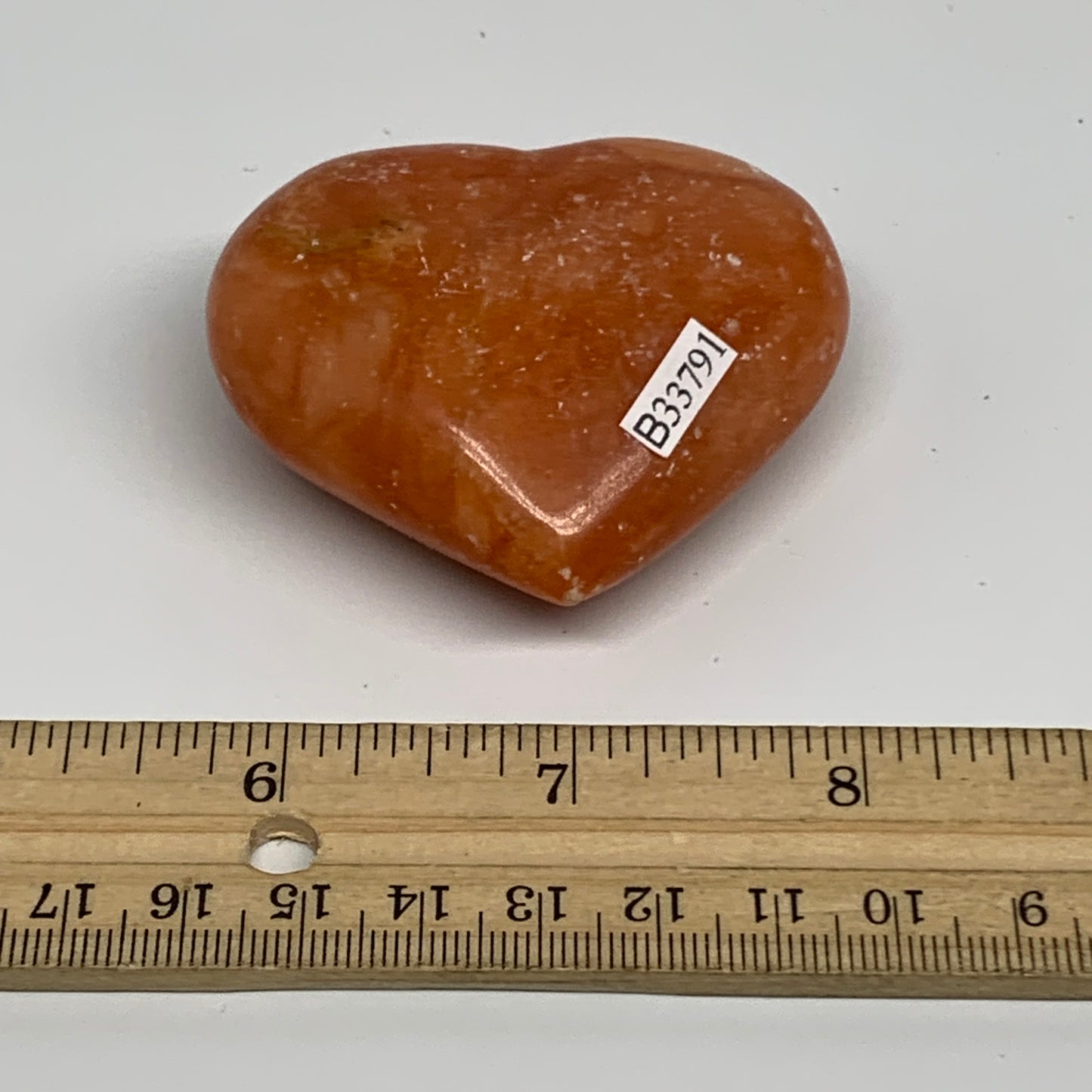 97.4g, 2.1"x2.4"x1" Orange Calcite Heart Gemstones from Madagascar, B33791