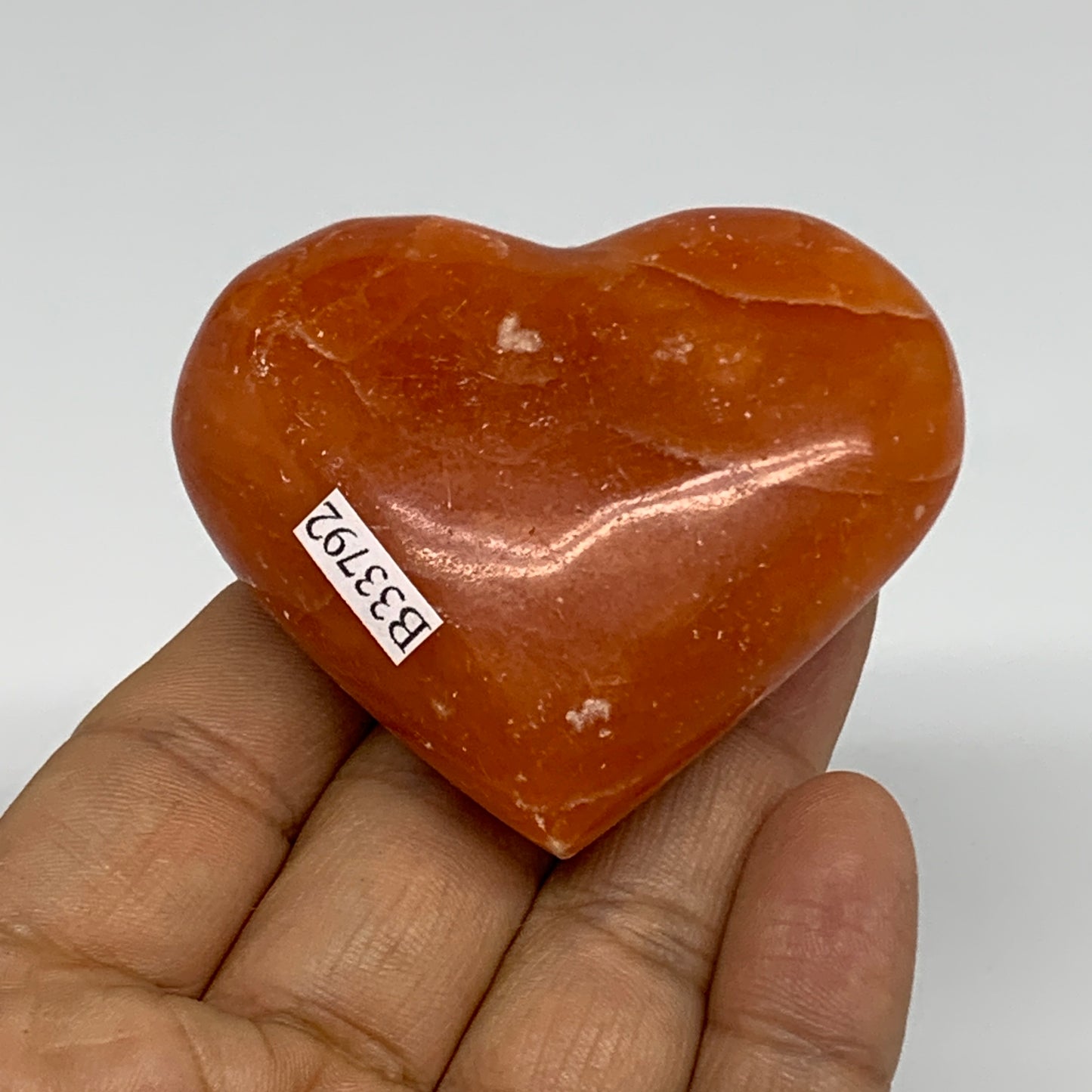 90.3g, 2.1"x2.4"x1" Orange Calcite Heart Gemstones from Madagascar, B33792