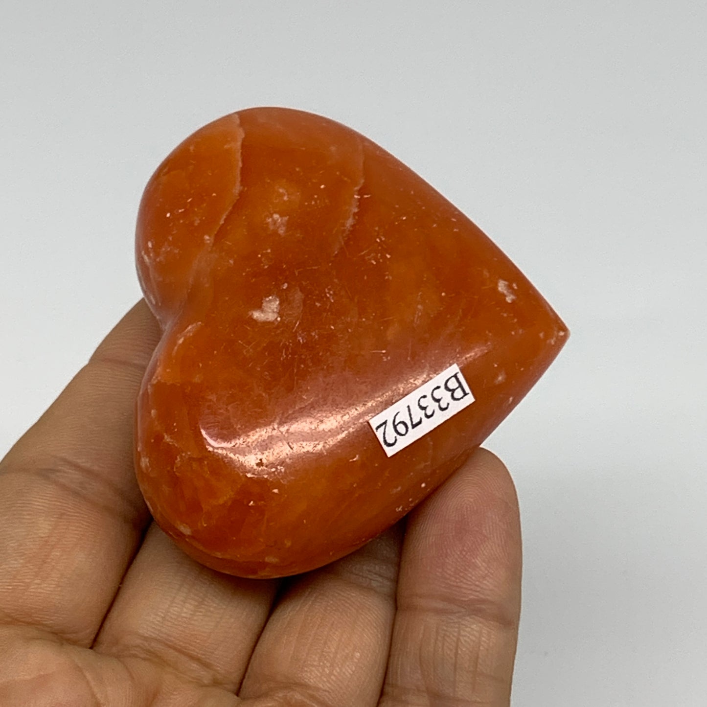 90.3g, 2.1"x2.4"x1" Orange Calcite Heart Gemstones from Madagascar, B33792