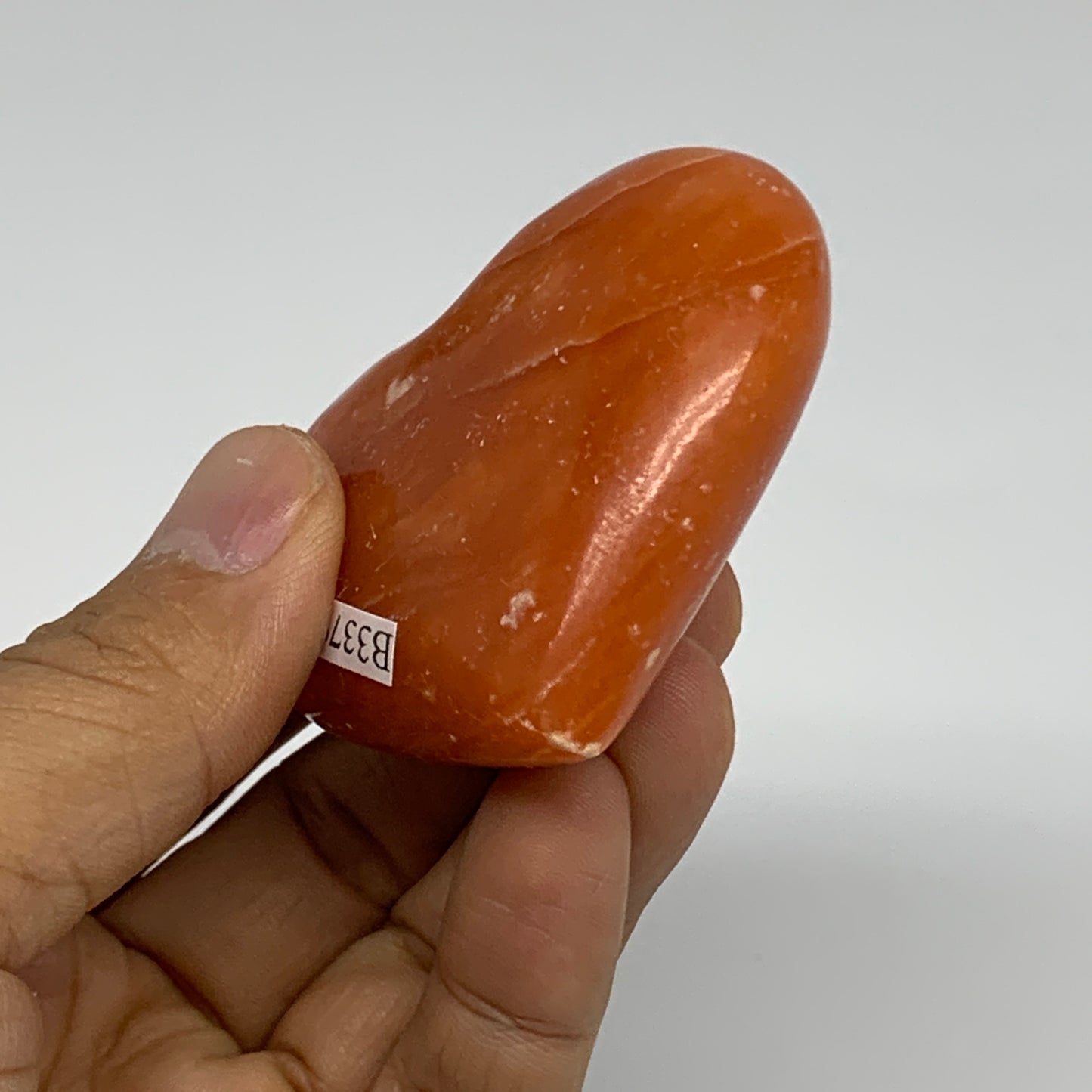 90.3g, 2.1"x2.4"x1" Orange Calcite Heart Gemstones from Madagascar, B33792