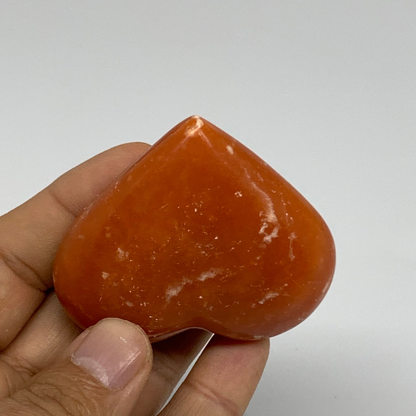 90.3g, 2.1"x2.4"x1" Orange Calcite Heart Gemstones from Madagascar, B33792
