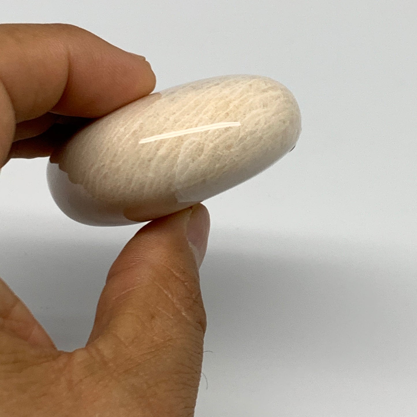 113.7g,2.4"x1.9"x0.9" Peach Moonstone Crystal Palm-Stone Polished Reiki, B27980