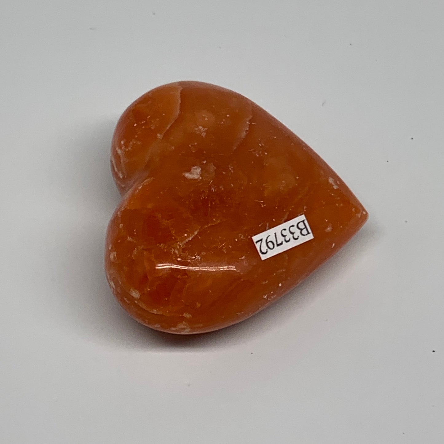 90.3g, 2.1"x2.4"x1" Orange Calcite Heart Gemstones from Madagascar, B33792