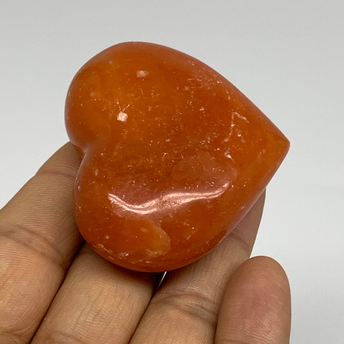 67.7g, 1.8"x2.1"x0.9" Orange Calcite Heart Gemstones from Madagascar, B33794