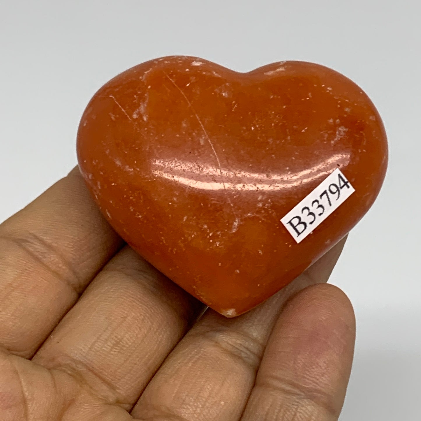67.7g, 1.8"x2.1"x0.9" Orange Calcite Heart Gemstones from Madagascar, B33794