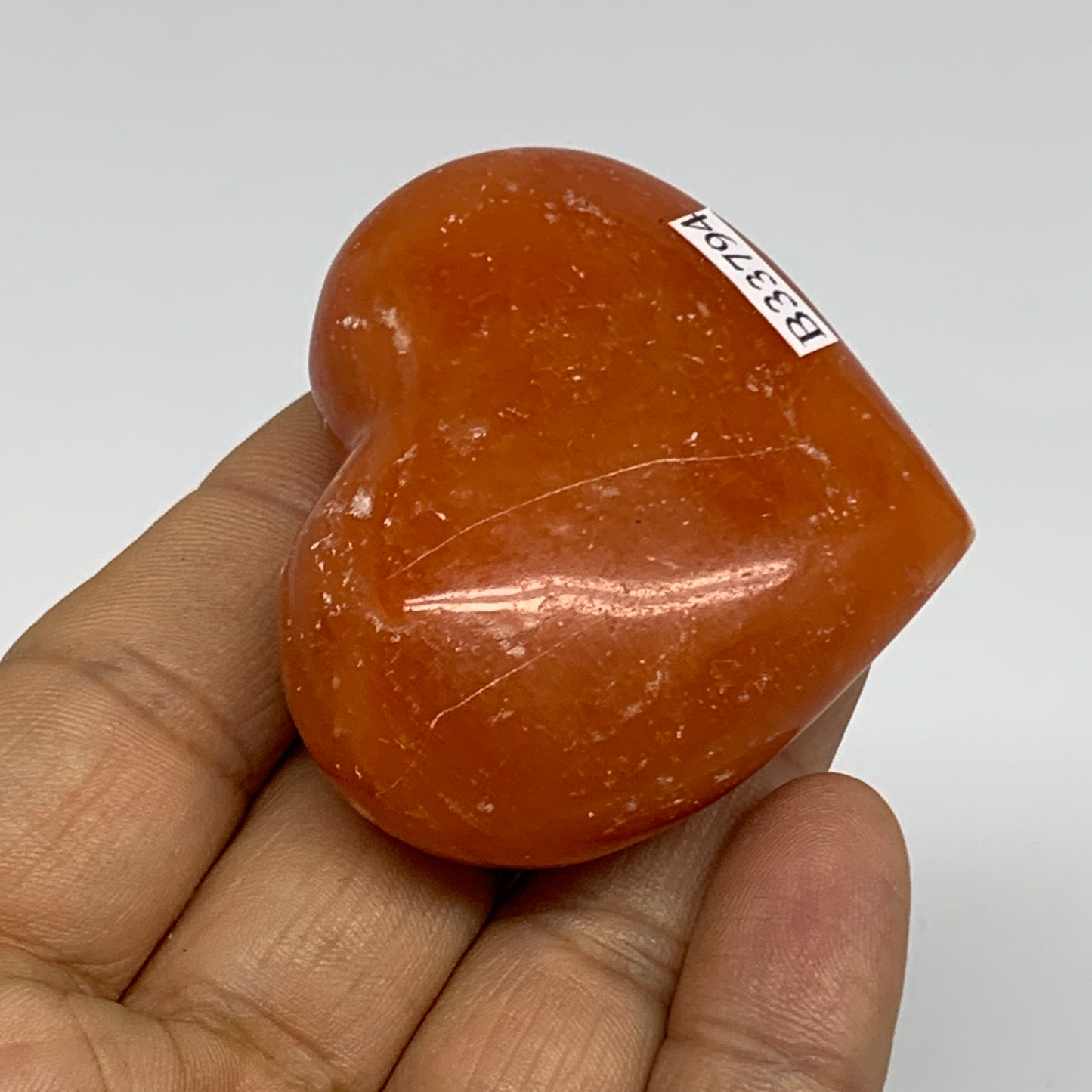 67.7g, 1.8"x2.1"x0.9" Orange Calcite Heart Gemstones from Madagascar, B33794