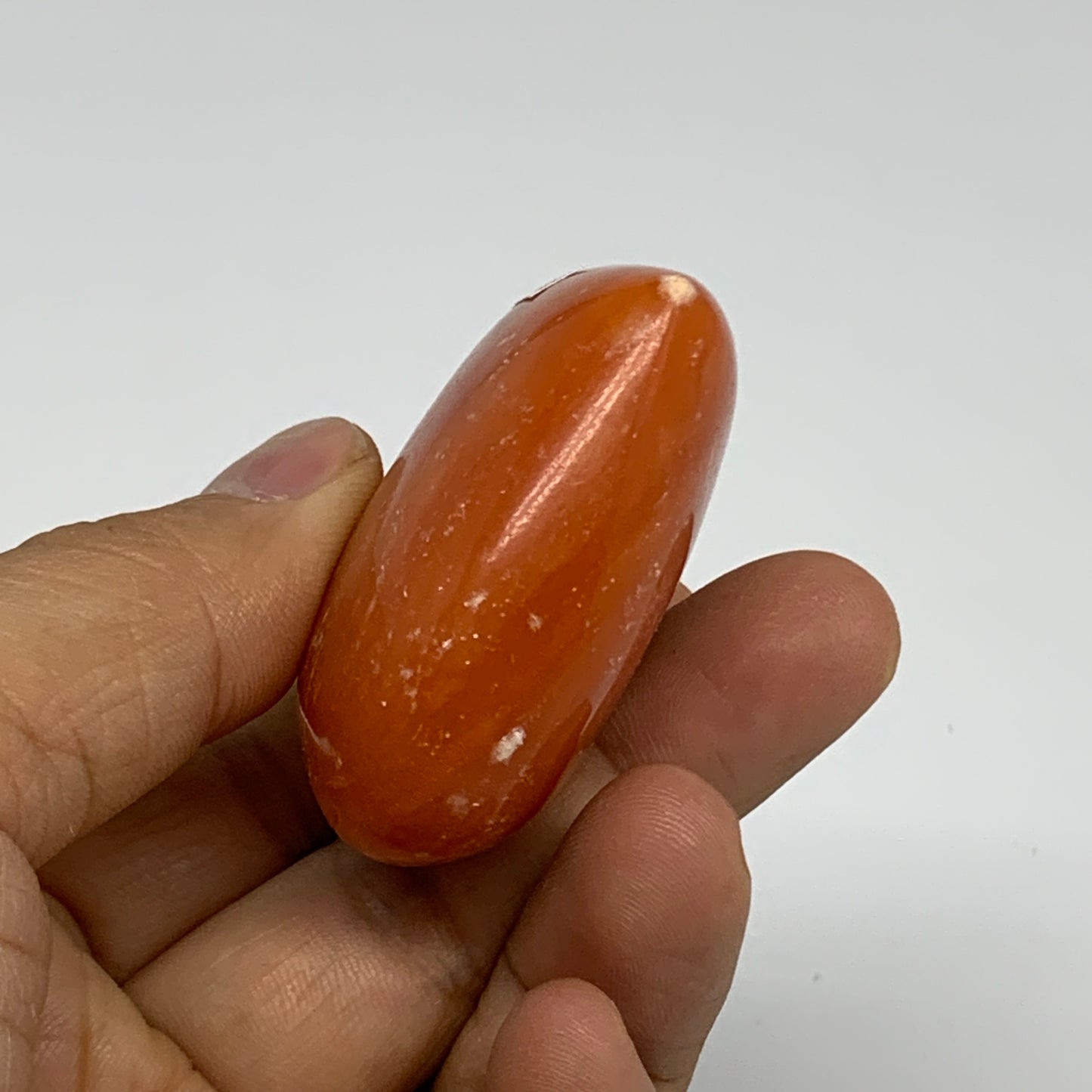 67.7g, 1.8"x2.1"x0.9" Orange Calcite Heart Gemstones from Madagascar, B33794