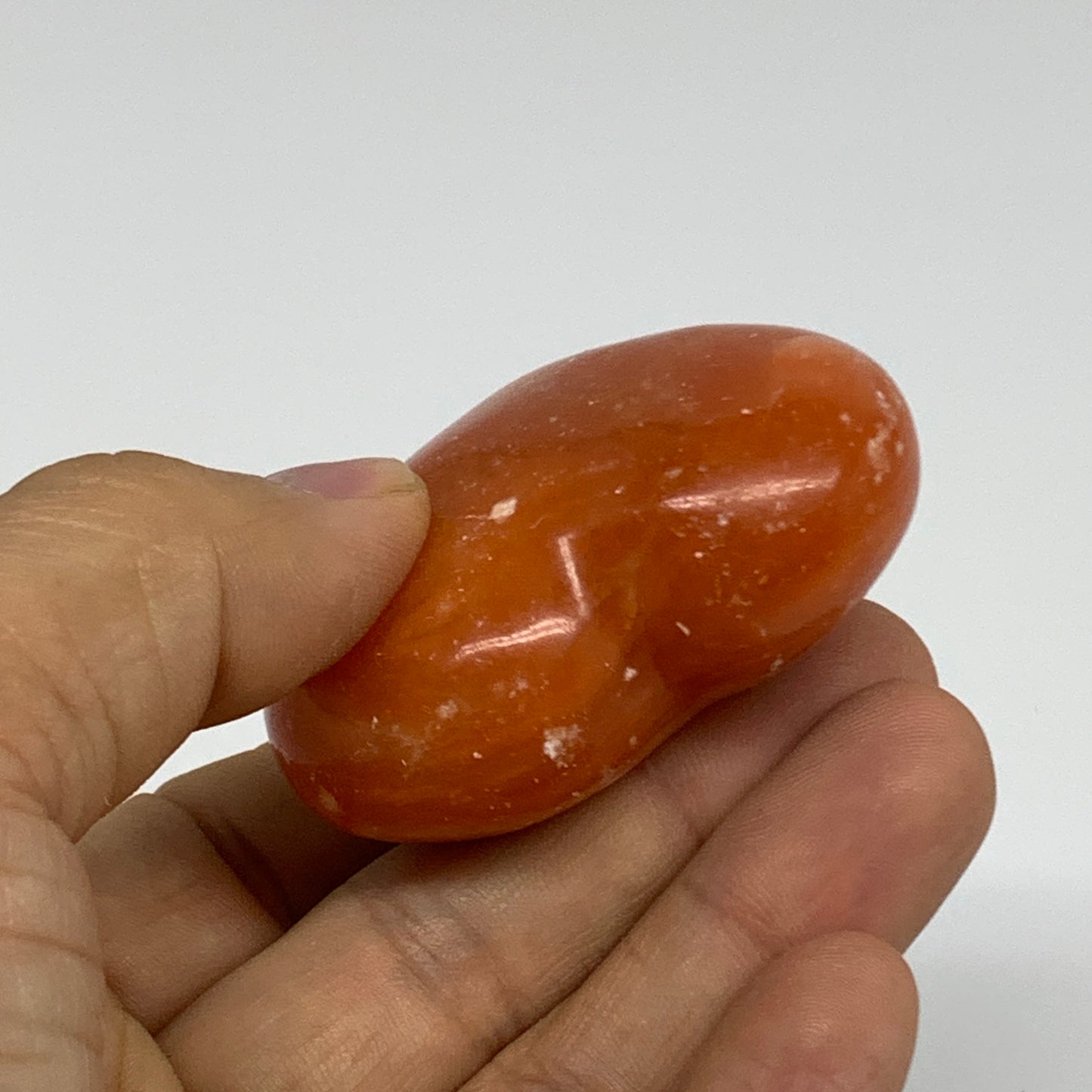 67.7g, 1.8"x2.1"x0.9" Orange Calcite Heart Gemstones from Madagascar, B33794