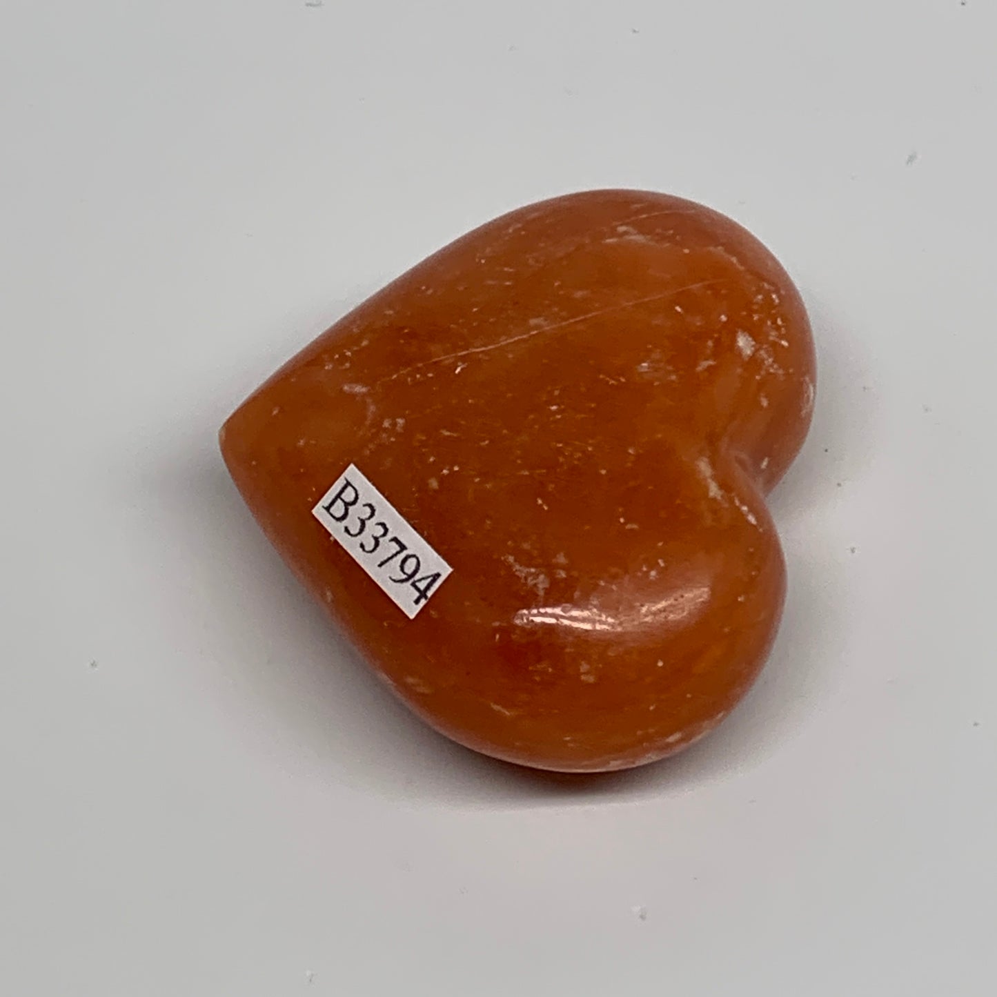 67.7g, 1.8"x2.1"x0.9" Orange Calcite Heart Gemstones from Madagascar, B33794