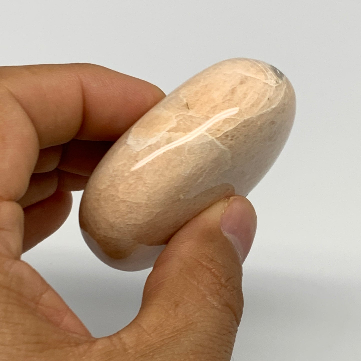 98.8g,2.3"x1.7"x0.9" Peach Moonstone Crystal Palm-Stone Polished Reiki, B27987