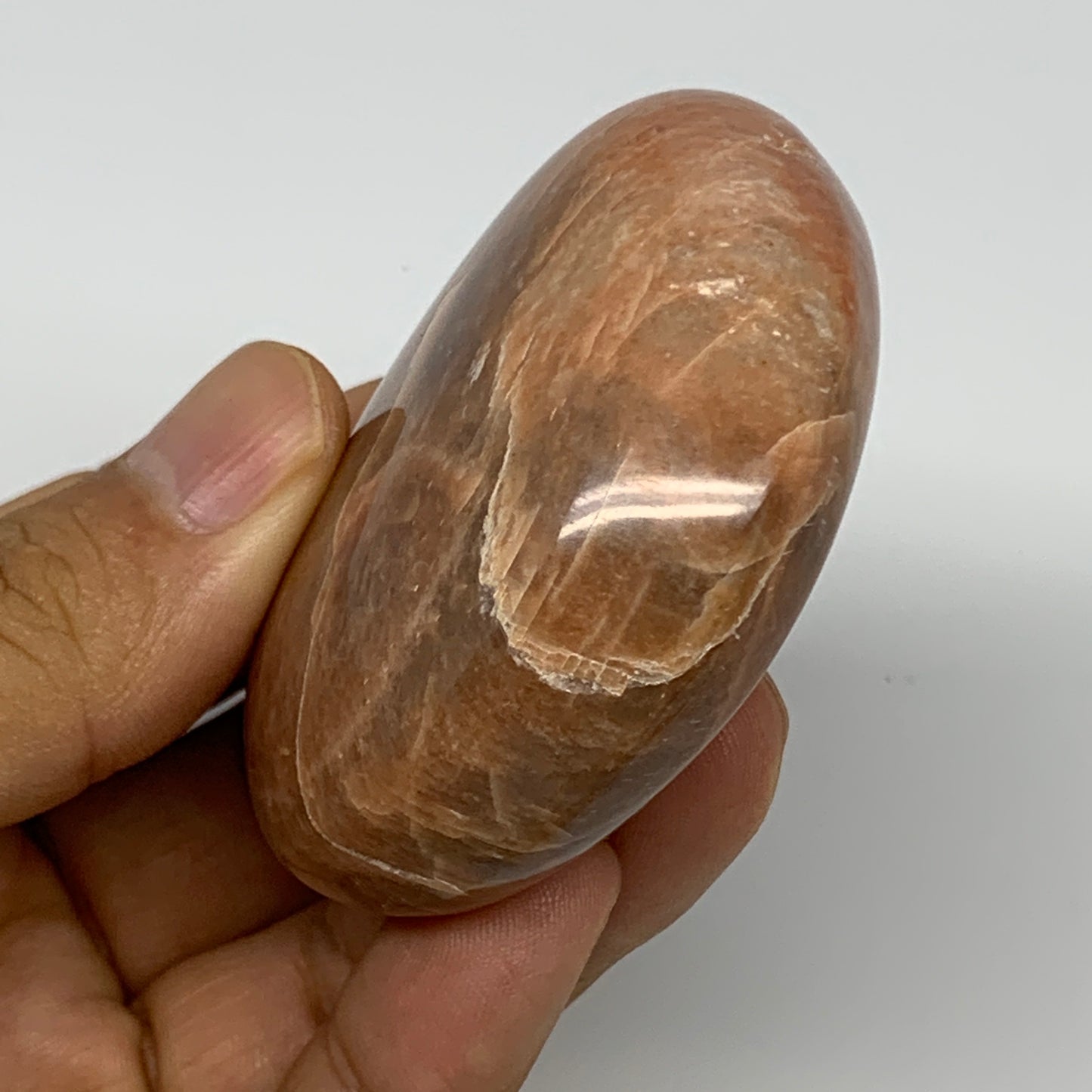 98.5g,2.4"x1.9"x1", Peach Moonstone Palm-Stone Polished Reiki Crystal, B15484