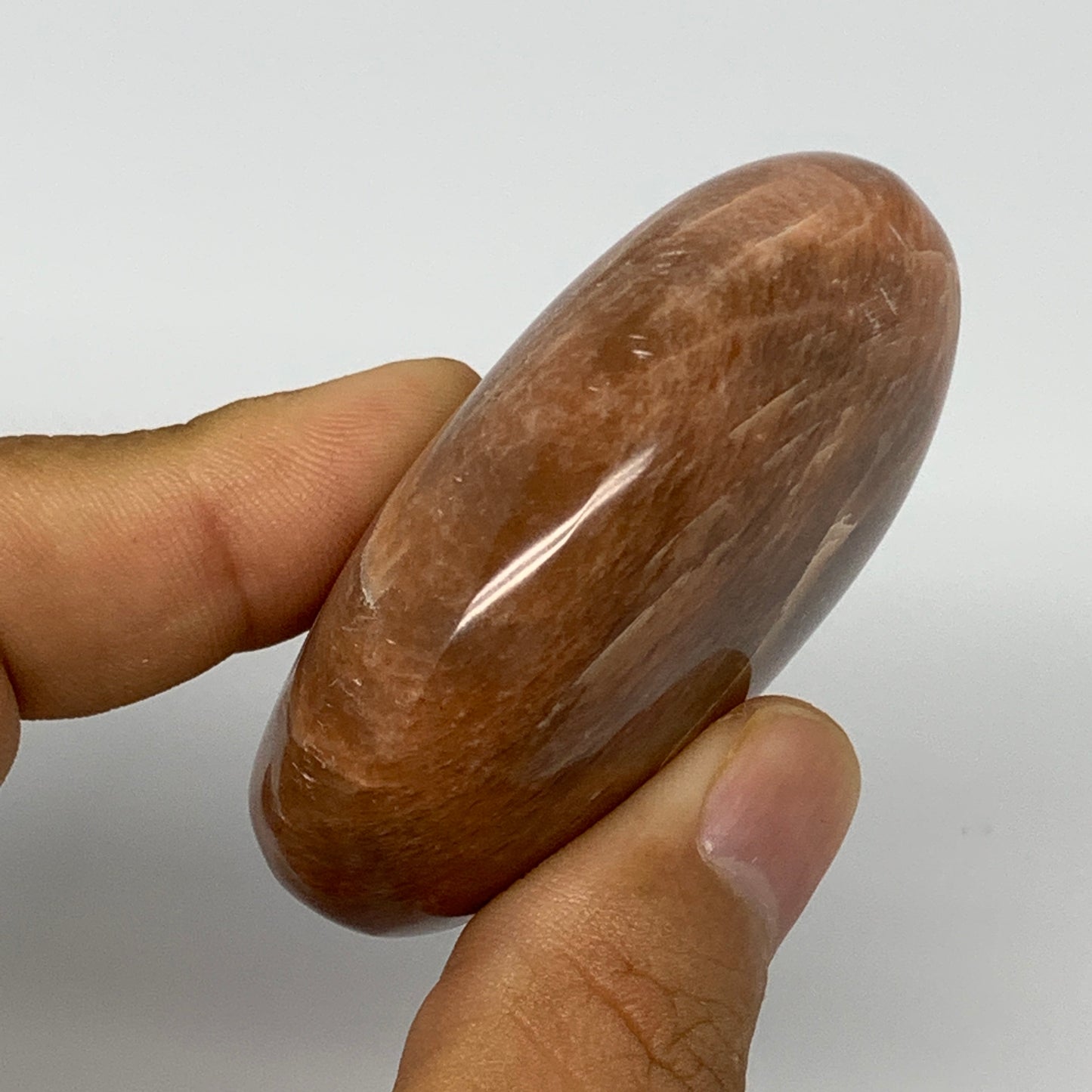 98.5g,2.4"x1.9"x1", Peach Moonstone Palm-Stone Polished Reiki Crystal, B15484