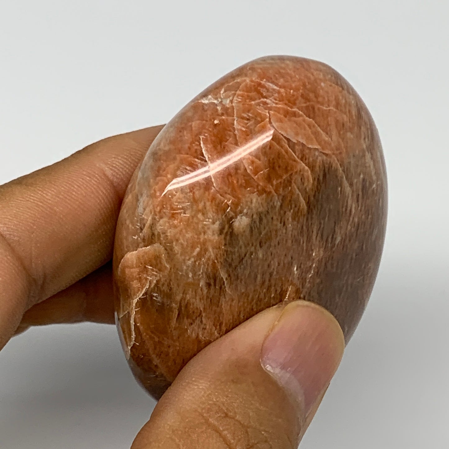 98.5g,2.4"x1.9"x1", Peach Moonstone Palm-Stone Polished Reiki Crystal, B15484