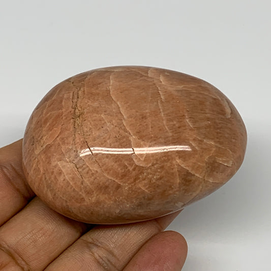 134.2g,2.7"x1.9"x1.1", Peach Moonstone Palm-Stone Polished Reiki Crystal, B15503