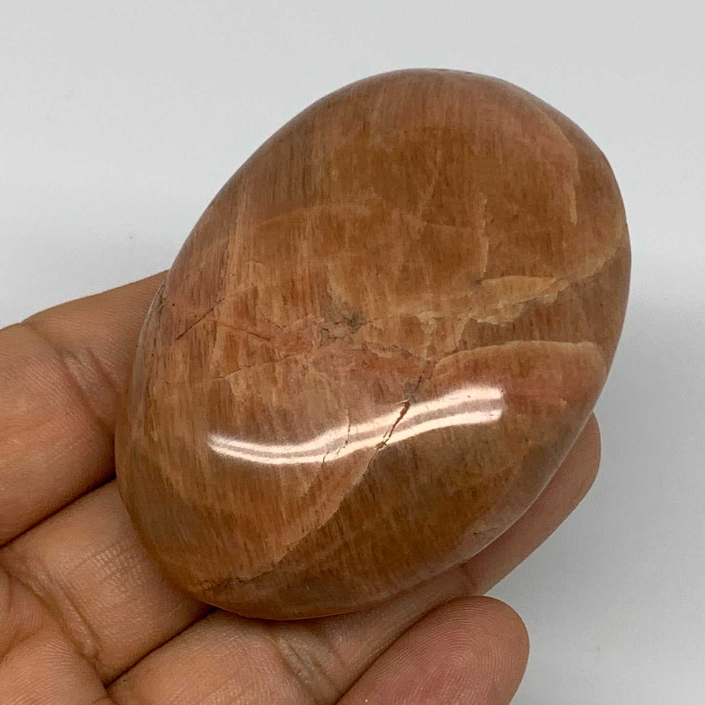 104.8g,2.7"x1.9"x1", Peach Moonstone Palm-Stone Polished Reiki Crystal, B15516