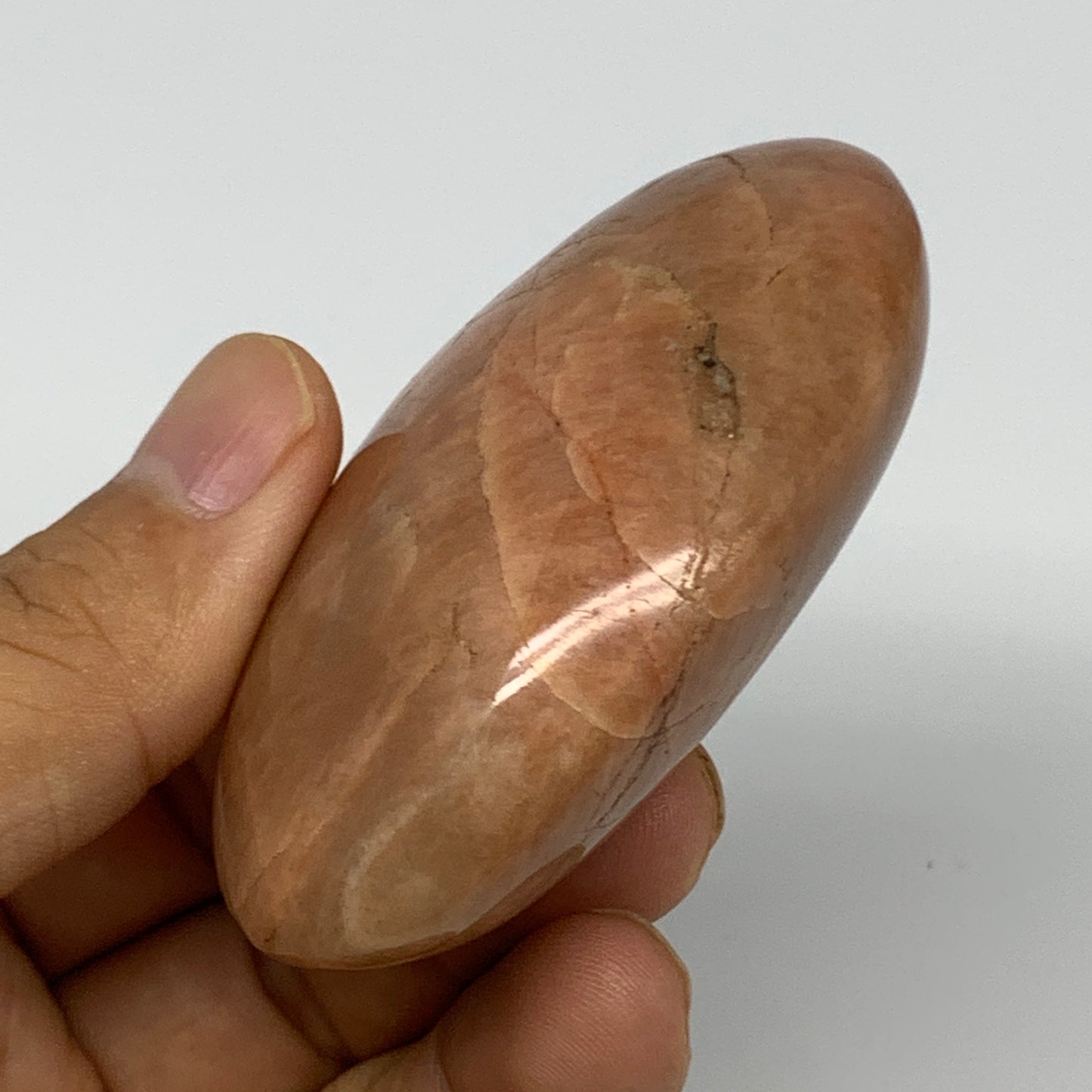 104.8g,2.7"x1.9"x1", Peach Moonstone Palm-Stone Polished Reiki Crystal, B15516