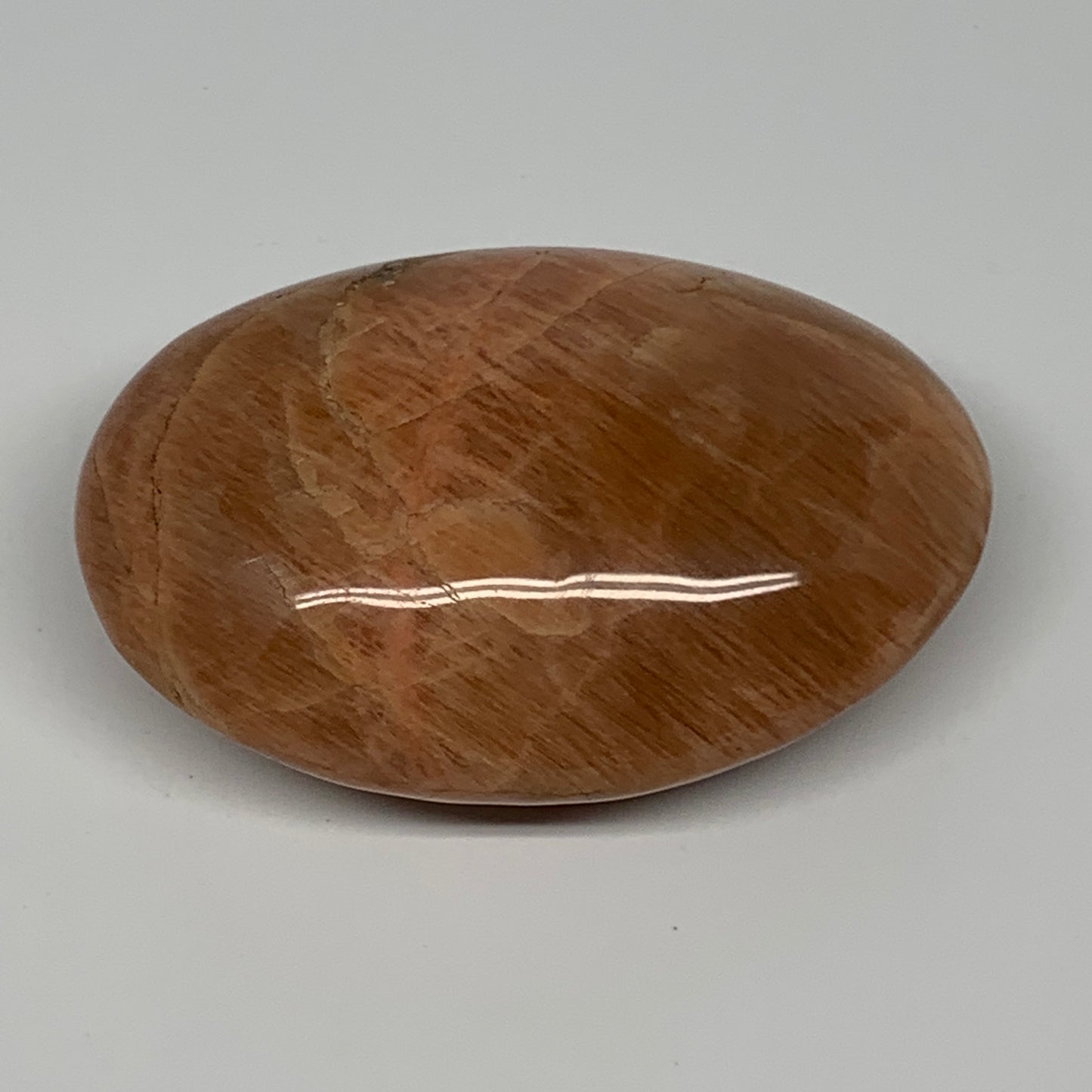 104.8g,2.7"x1.9"x1", Peach Moonstone Palm-Stone Polished Reiki Crystal, B15516