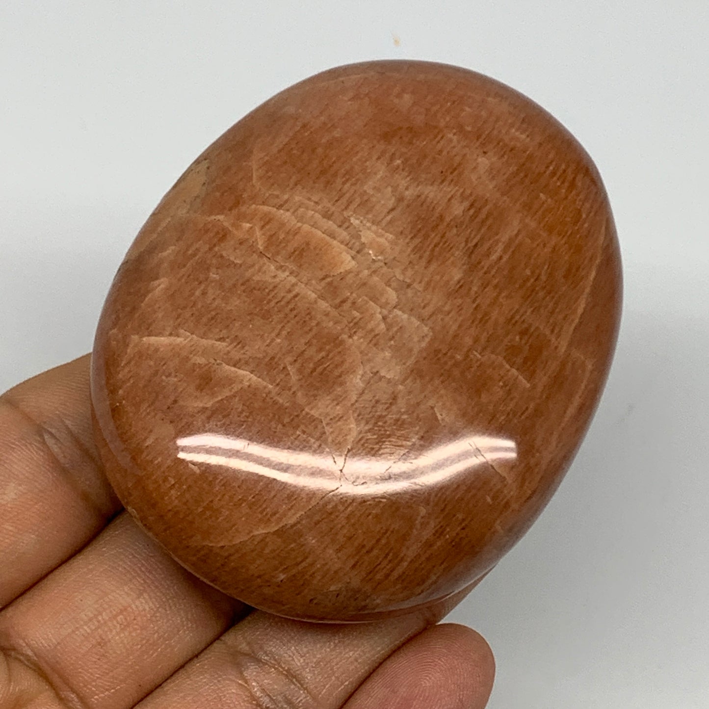 154g,2.7"x2.2"x1.1", Peach Moonstone Palm-Stone Polished Reiki Crystal, B15528