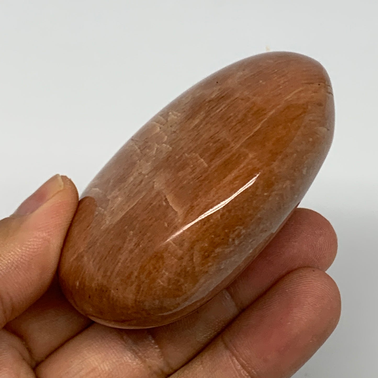 154g,2.7"x2.2"x1.1", Peach Moonstone Palm-Stone Polished Reiki Crystal, B15528