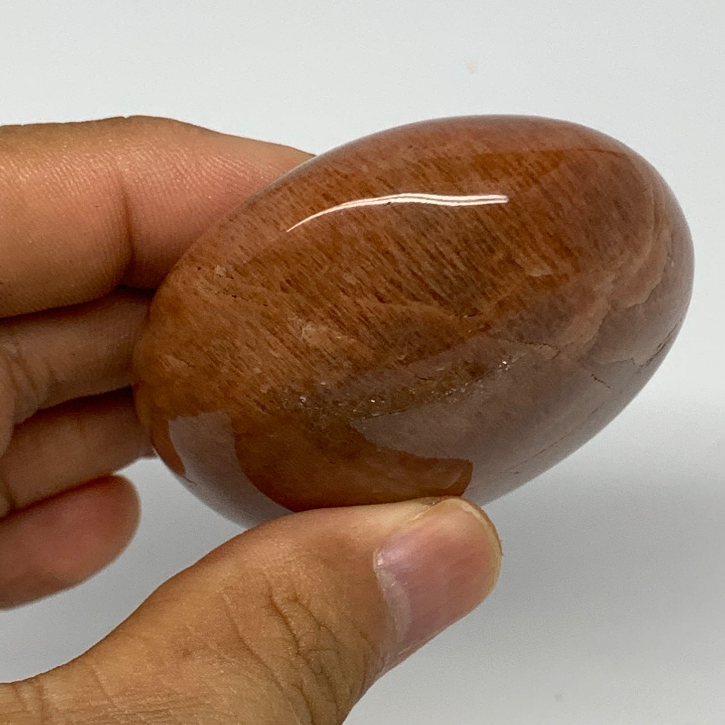 154g,2.7"x2.2"x1.1", Peach Moonstone Palm-Stone Polished Reiki Crystal, B15528