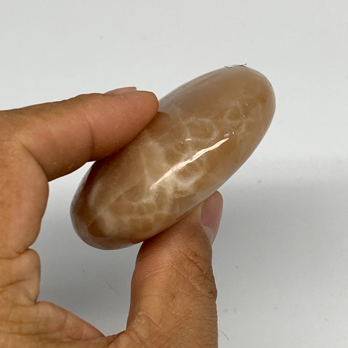 155.2g, 2.7"x2.3"x0.9",Honey Calcite Palm-Stone Crystal Polished @Pakistan,B2446