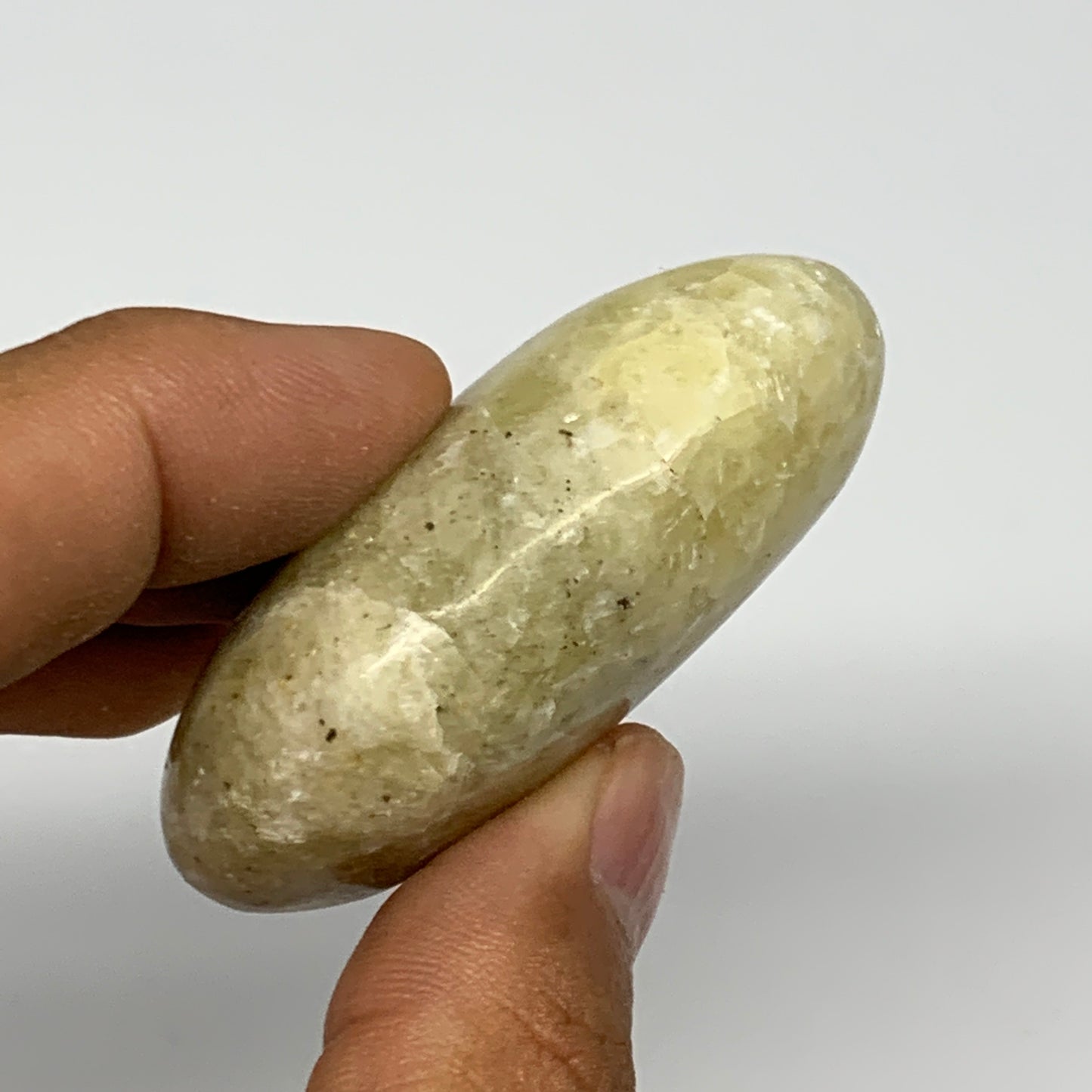 64.6g, 2.1"x1.4"x0.8", Natural Yellow Calcite Palm-Stone Crystal Polished Reiki,