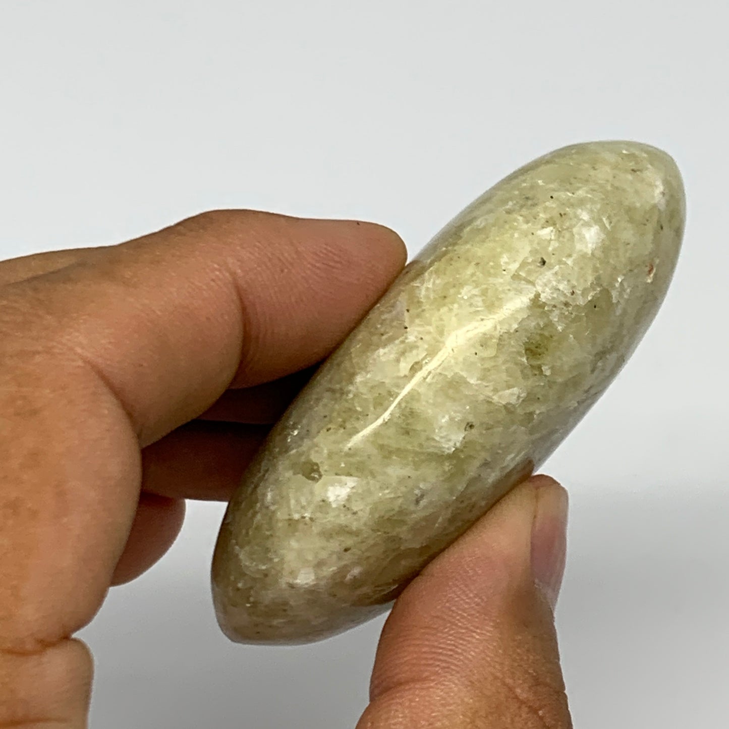 94.1g, 2.5"x1.7"x0.9", Natural Yellow Calcite Palm-Stone Crystal Polished Reiki,